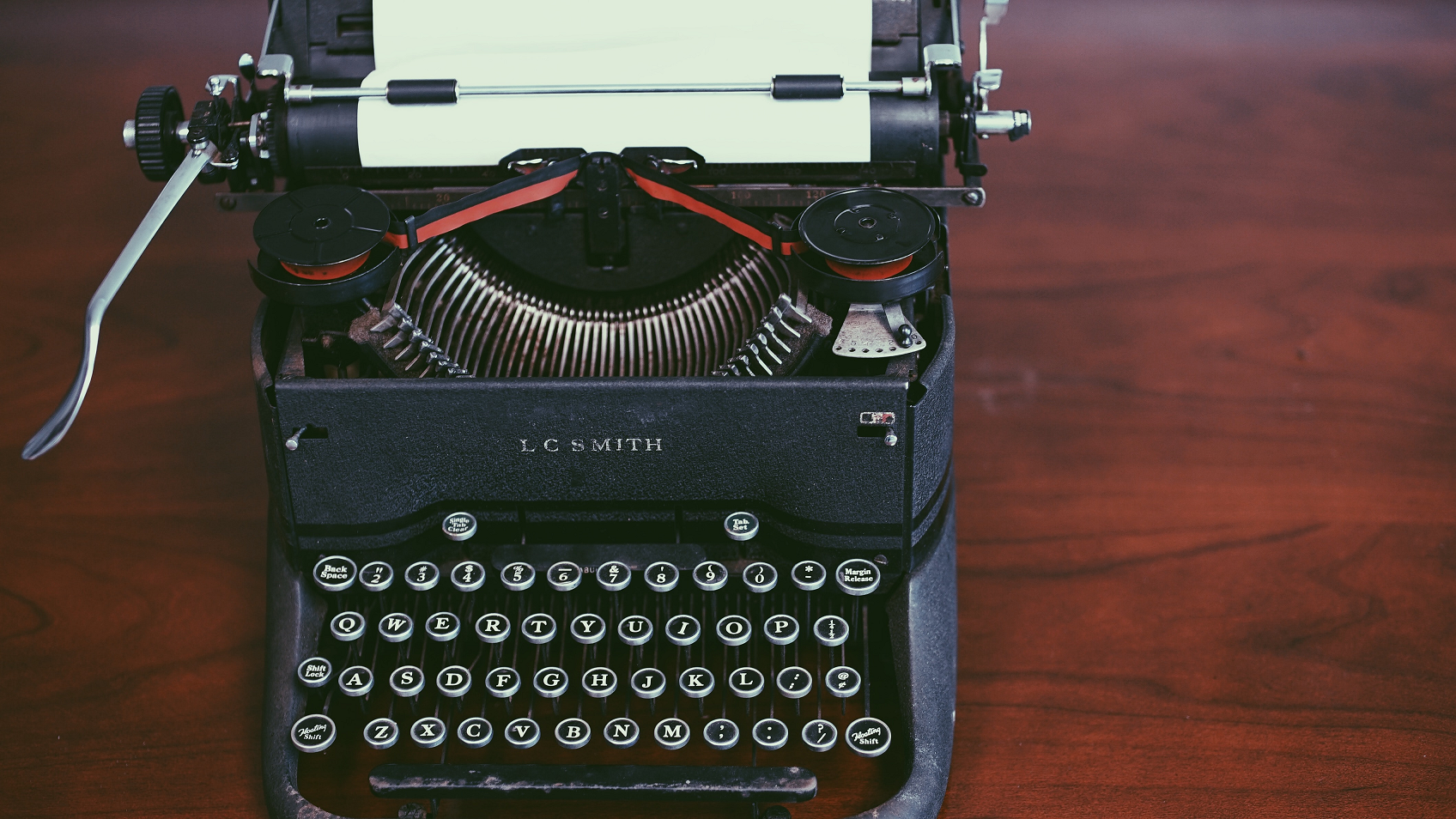 Old time typewriter on brown table