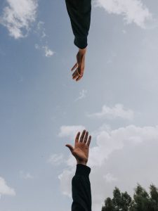 Two hands reaching towards each other - representing data recovery page (Inderly IT - Toronto support services)