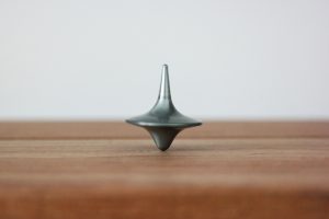 Spinning top on desk symbolizing trust - Inderly IT (Toronto)